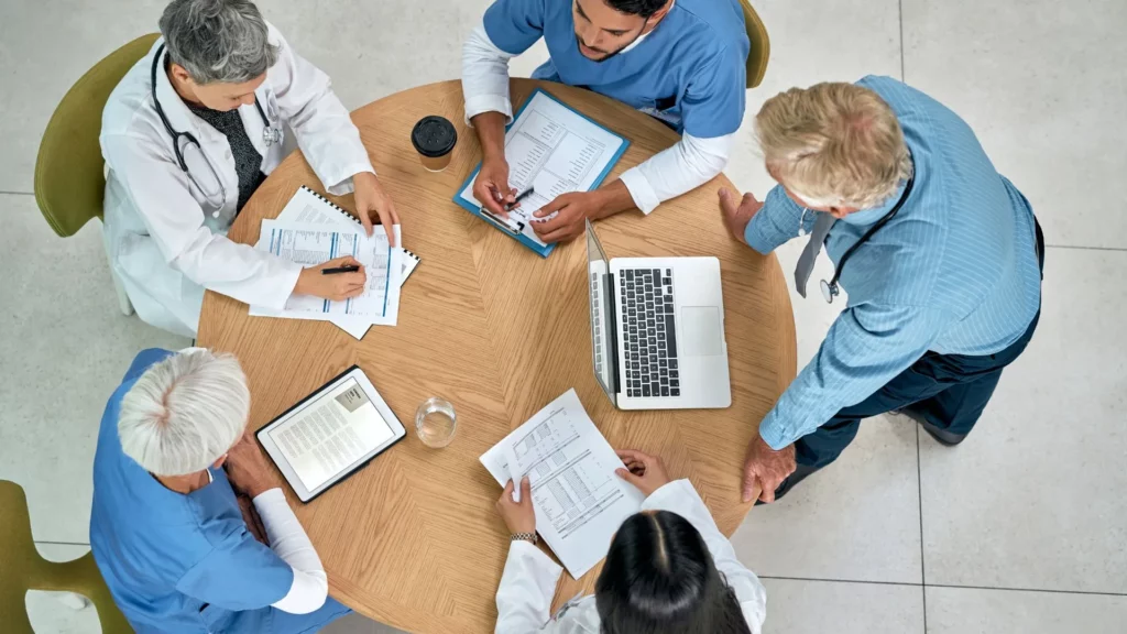 Team of healthcare physicians during an RCM meeting