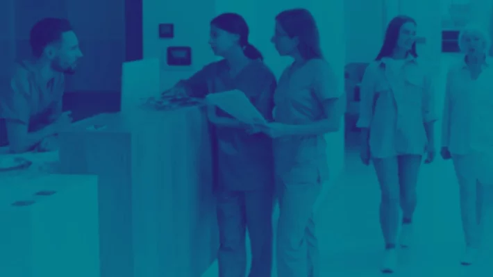 Hospital reception filled with doctors and patients - ACOs